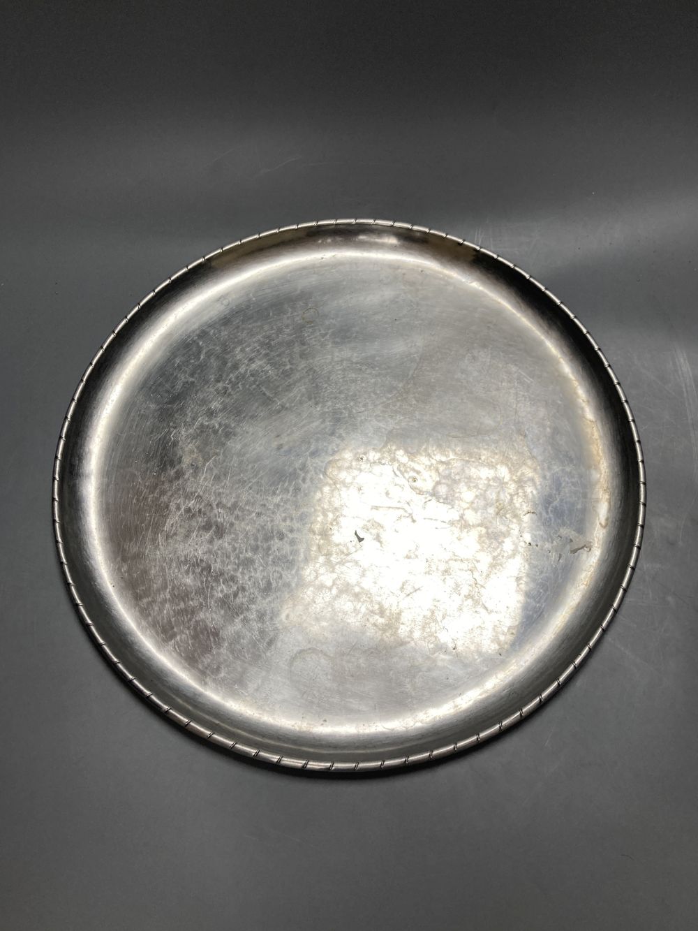 A Keswick School of Industrial Arts planished pewter tray, diameter 38cm